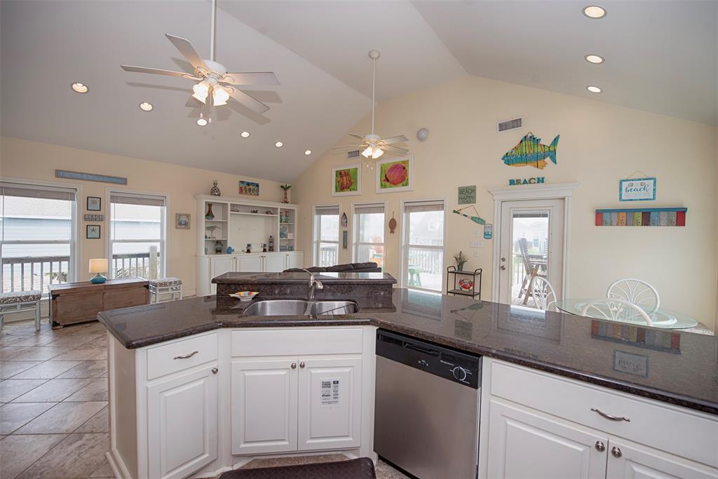 A view of the kitchen open to both the family room as well as the dining area.