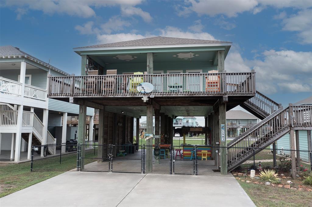 Home has front gate and an amazing wrap around balcony on the living level of the home.