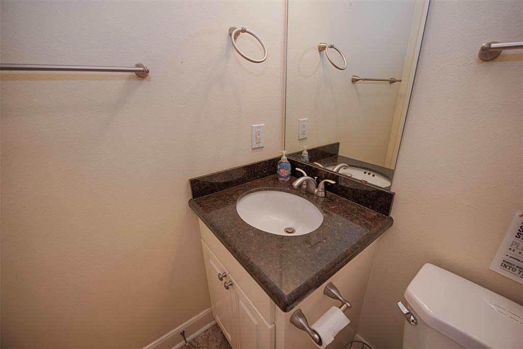 Additional bathroom with granite vanity just outside of the 2nd bedroom.