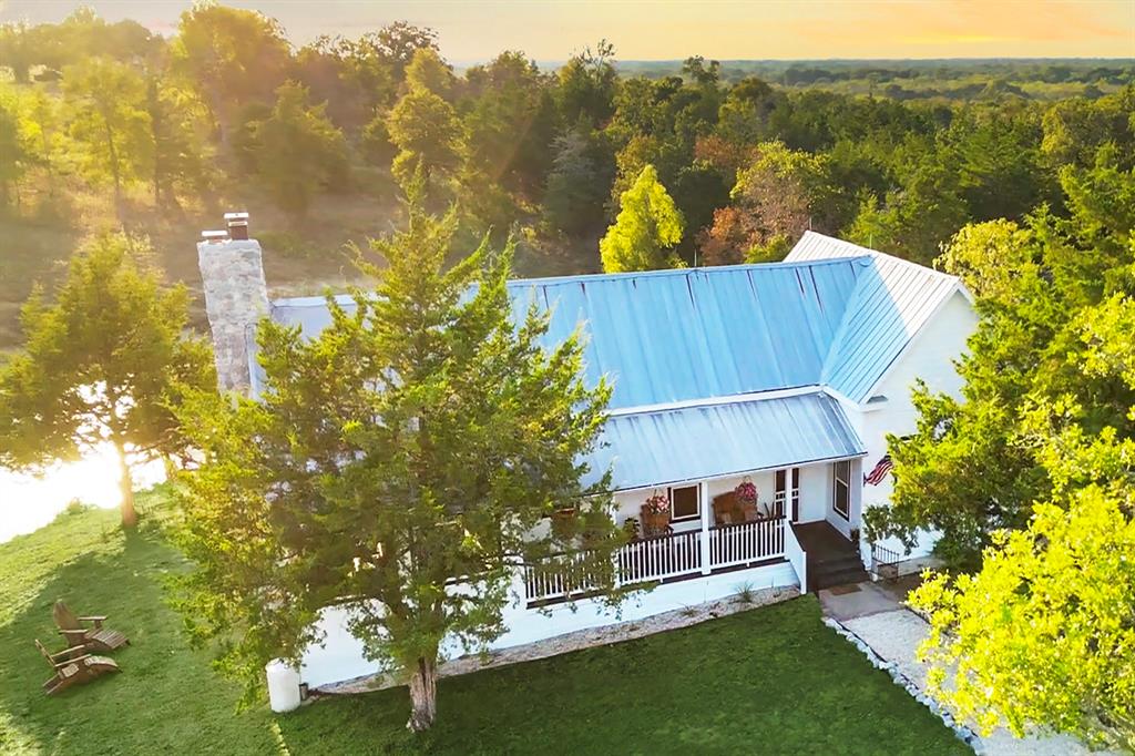 FABULOUS LOCATION:11 MINS TO ROUND TOP, 30 MINS TO BRENHAM, 60 MINS TO AUSTIN, 1 HR 23 MINS TO HOUSTON!  QUINTESSENTIAL RESTORED FARMHOUSE & SEP 1250 SQ FT PARTY BARN! PERFECT FOR THE FAMILY THAT WANTS A VACA RETREAT IN THE COUNTRY! PANORAMIC VIEWS 18.77 BEAUTIFUL ACRES & POND.  WATCH YOUR HORSES GALLOP AROUND THE WILDFLOWERS OR PLAY IN THE SNOW! WALK UP THE CHARMING FRONT PORCH ENTER MAGNIFICENT GREAT RM W PINE WALLS, 2 STORY CEILING, COZY UP TO STONE FP.  OPENS TO KIT W BRAND NEW CABINETS, ISLAND, FARM SINK & APPLS.  PARLOR LEADS TO FLEX RM & BEDROOMS, SUN ROOM, NEW BATHRM W DOUBLE TRAVERTINE SHOWER. OUTDOOR AREAS W STONE FP. PORCH, PATIO, POND, GREAT FOR PARTIES, GRILLING, ENJOYING SUNSETS STARRY NIGHTS, SKEET SHOOTING. PARTY BARN IS WALKING DIST FROM MAIN HOUSE PLAY AREAS, POOL TABLE, & INSIDE PARKING.  BEST KEPT SECRET IS THAT THIS PROP. IS ADJ TO 1000'S OF ACRES OF PROTECTED LAND, BOW HUNTING ALLOWED, DUCK, HOG RAB HUNTING!  LAKE SOMERVILLE STATE PK CLOSE BY FOR BOATING & FISHING