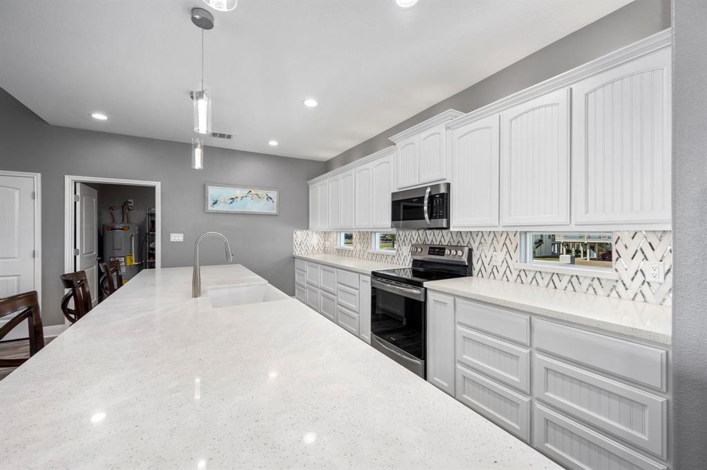 White cabinets with backsplash windows for a view.