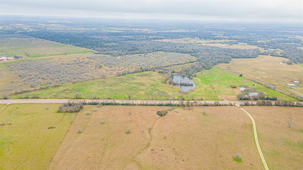 Presenting a prime 20-Acre parcel boasting extensive state highway frontage, this versatile property offers an array of possibilities. Nestled amidst fertile soil featuring lush bermuda hay, this perfect landscape encompasses a beautiful stocked pond. With its ideal location, this property serves as a canvas for diverse ventures, from recreational pursuits to agricultural endeavors such as cattle ranching and equine program. Its potential extends even further, inviting considerations for commercial utilization, benefitting from its placement and frontage along a known state highway. Regardless of what your dream is, this property is ready to make it come true!
