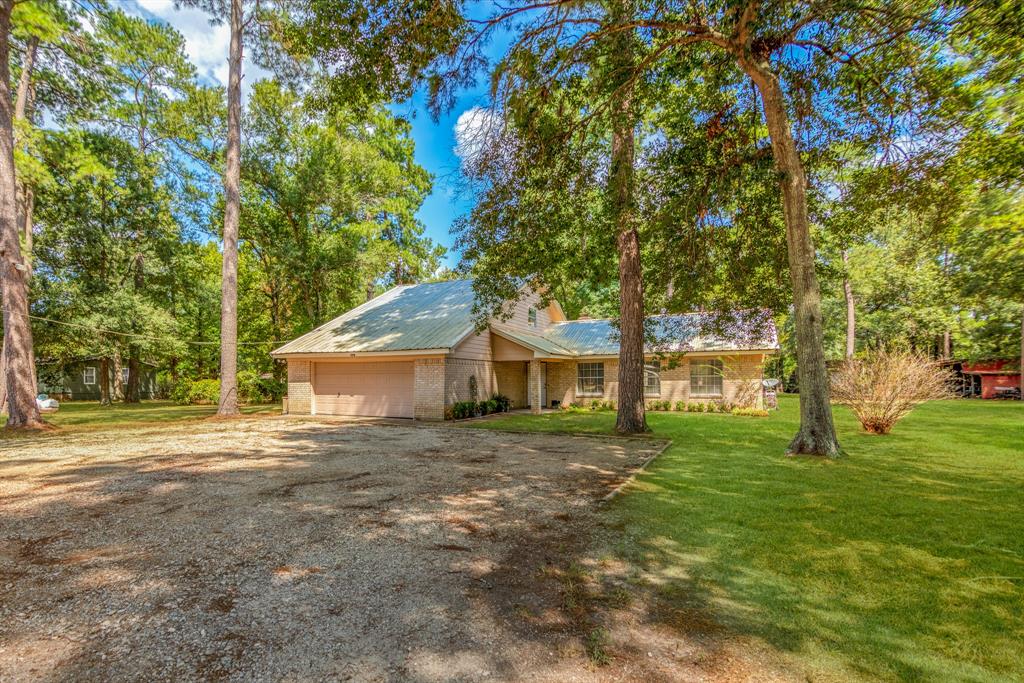 242 CR 2198 Cleveland, Texas Located in Tarkington ISD just 10 minutes from Cleveland, this 3BR/2BA brick home is nestled among the tall shade trees on 7.64 acres. There is a spacious family room downstairs with cathedral ceilings and a corner fireplace with great view of the back yard. It is conveniently located near the dining area and large country kitchen with lots of counterspace/cabinets and stainless steel appliances. All bedrooms are also located downstairs. Upstairs is a loft area used as a game room for kids and guest to enjoy. Venture out onto the back patio and enjoy the peaceful country atmosphere. The property also contains a barn to house your horse, chickens or show/4H animal. Check out the photo gallery to view all the special features this home has!