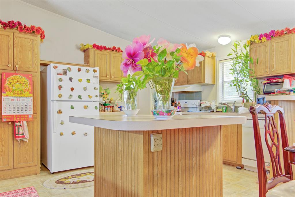 Culinary joy meets relaxation: an expansive open concept kitchen seamlessly merges with a dining room and living space. Your home, your sanctuary.