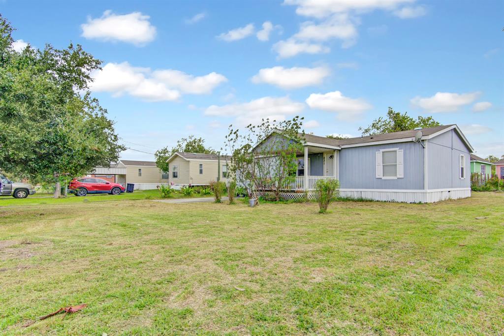 A welcoming front of home leads to a spacious yard, offering myriad possibilities for relaxation, entertainment, and creative landscaping ventures.