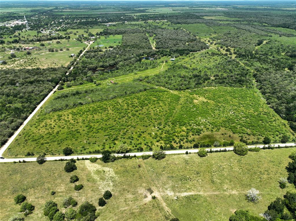 Small acreage tract and Unrestricted. between Katy and San Antonio. Rural water to be brought to road. Power poles on tract. Seller will fence and install new entry gate on CR 429. No minerals convey. Part of larger tract. Subject to final county approval