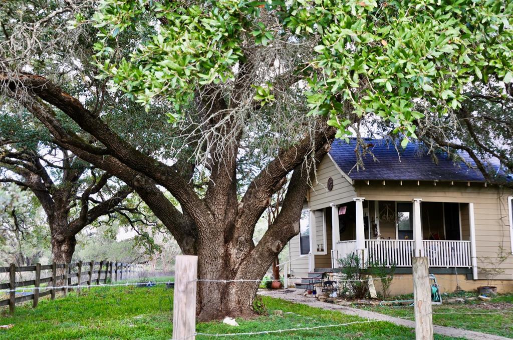 Nestled in the shade of a grandaddy oak tree is this charming 3 bedroom, 2 bath home on 39.2 acres.  It has not been occupied for several months and may need some TLC and clean-up.  It backs up to property owned by Nails Creek State Park and would make a great hunter’s retreat or a family home.  The house is all electric and was built in 1910, moved onto the property and restored in 2008.  The interior was painted, and cabinets and hardwood floors refinished.  There was also some exterior restoration, has hardi board siding, a front wraparound porch and back porch with a patio.  The property is dotted with giant oaks and there are several outbuildings, a barn and a child's playhouse complete with a loft and ladder. The property is dotted with mature live oaks and a pond.  Rural water is available.  Near the entrance is a gas storage tank facility.  There is a very small area that falls in the flood zone… see attachments for this info.  Call the listing agent to schedule a showing.