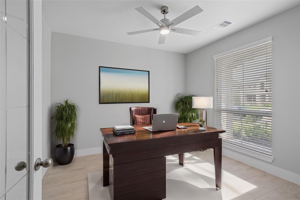 Nestled away quietly in the front of the home is the handsome and grand home office. Featuring high ceilings, ceiling fan, neutral paint, gorgeous flooring, recessed lighting and a large window with privacy blinds.