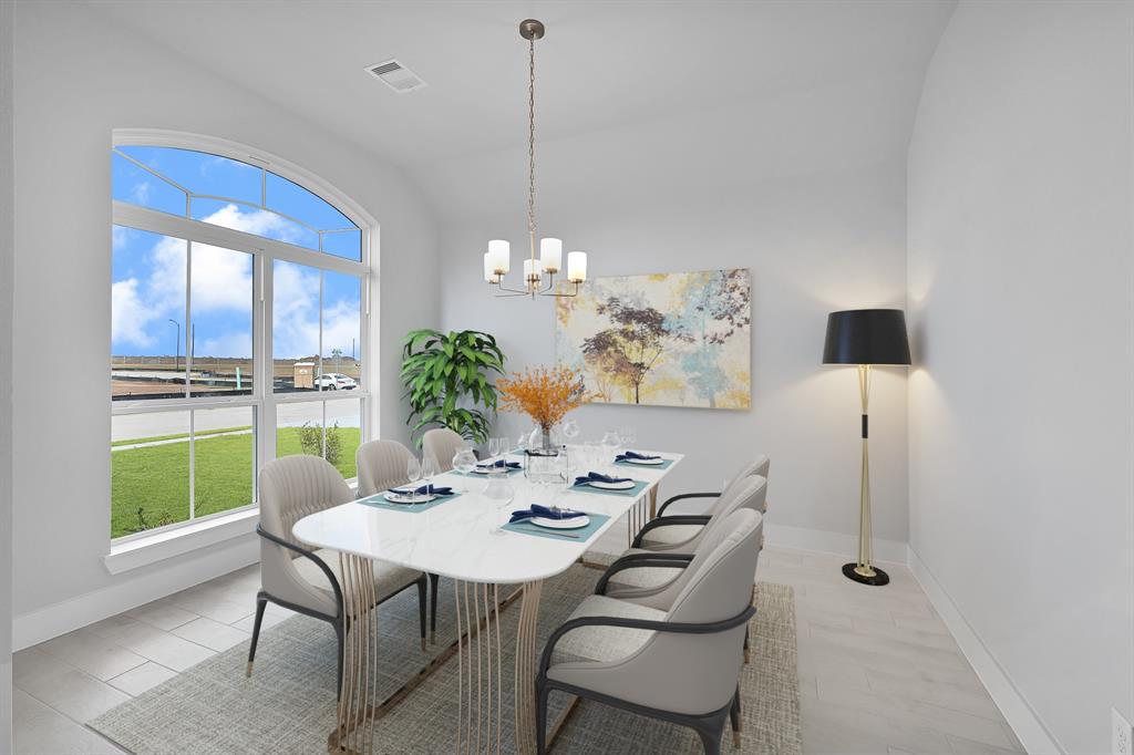 This stunning kitchen displays such a beautiful contrast with the dark stained cabinets, custom neutral paint, granite countertops, light modern backsplash, oversized kitchen with extra storage, breakfast bar, recessed lighting, high ceilings and walk in pantry.