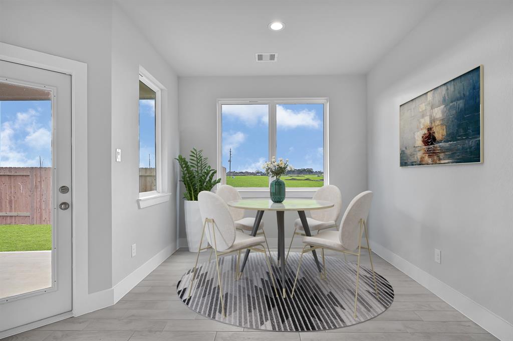 This primary bathroom is definitely move-in ready! Featuring a separate garden tub for soaking after a long day with custom tile detailing, dark stained cabinets with light countertops, spacious walk-in closet with shelving, high ceilings, custom paint, sleek and dark modern finishes.