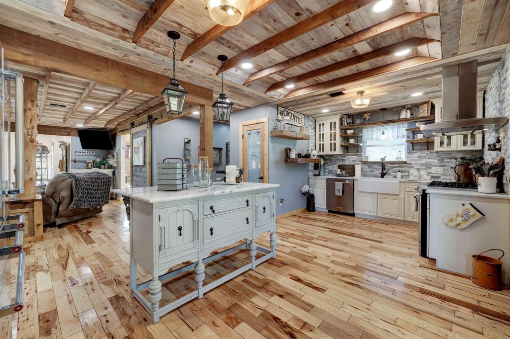 A Chef dream Kitchen with plenty space and functionality. Notice the all matching stainless steel appliances wall oven and microwave offered. Farmhouse sink with window view, walk-in pantry with build in shelving.