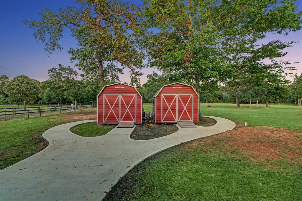 2 Barndominium/red barn dressing rooms featuring a full bath in each. Continuing up the long walkway leads into the venue. This could make a great Guest Quarters.