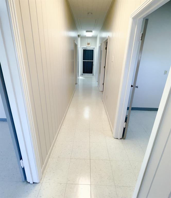 Hallway, to the right is the kitchen, utility room and bedroom