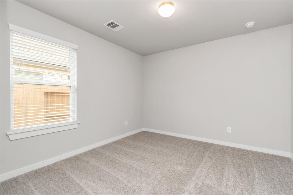 Generously sized secondary bedrooms, complete with spacious closets and soft, inviting carpeting.