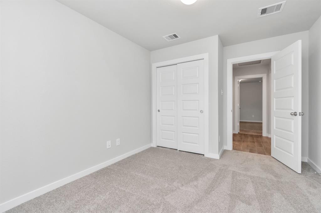 Generously sized secondary bedrooms, complete with spacious closets and soft, inviting carpeting.