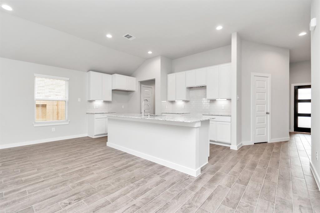 This generously spacious and bright kitchen is a dream realized!