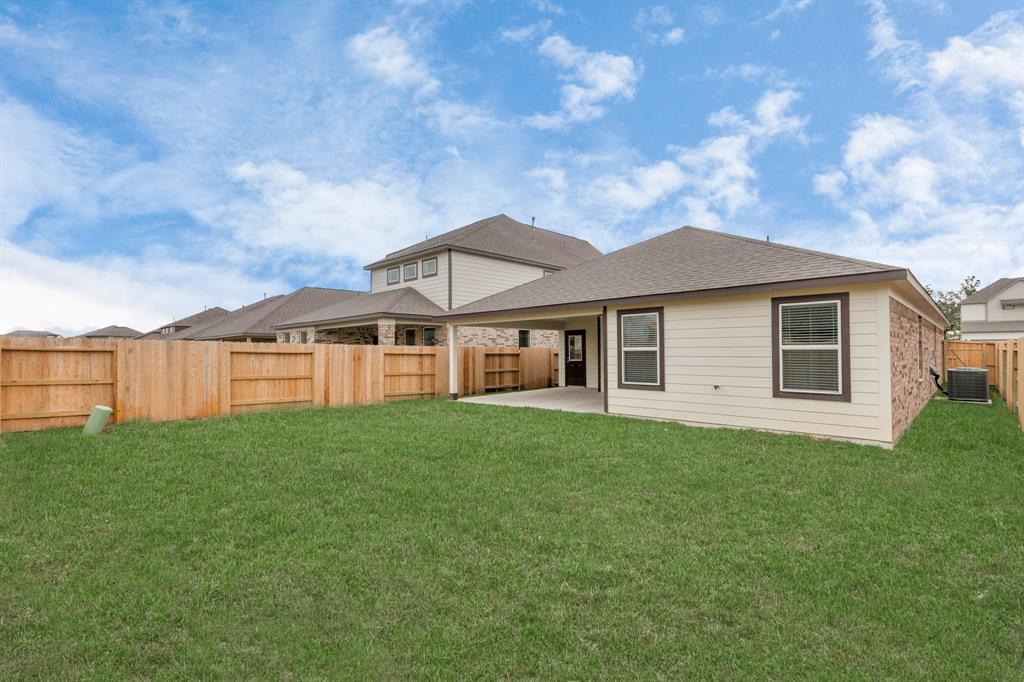 backyard retreat, offering an abundance of space for kids to play and explore. The possibilities are endless in this outdoor haven, where the joy of open-air activities and family gatherings awaits.