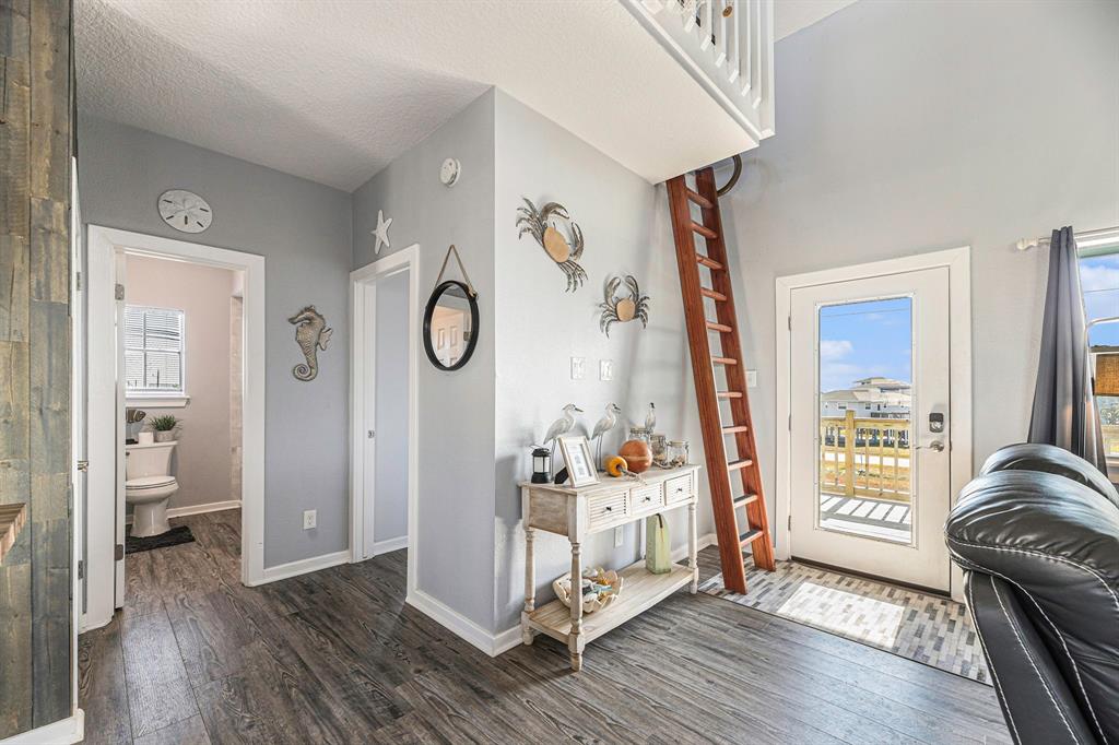 The ladder accesses the loft above the primary bedroom