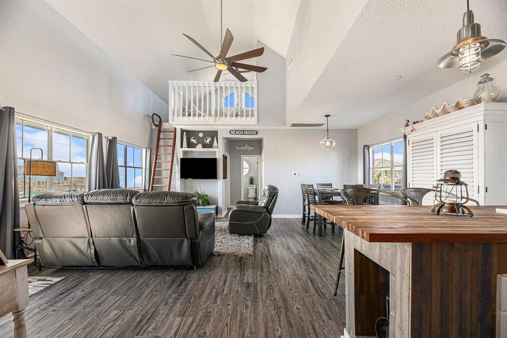 Open living and dining area with access to the 2 lofts