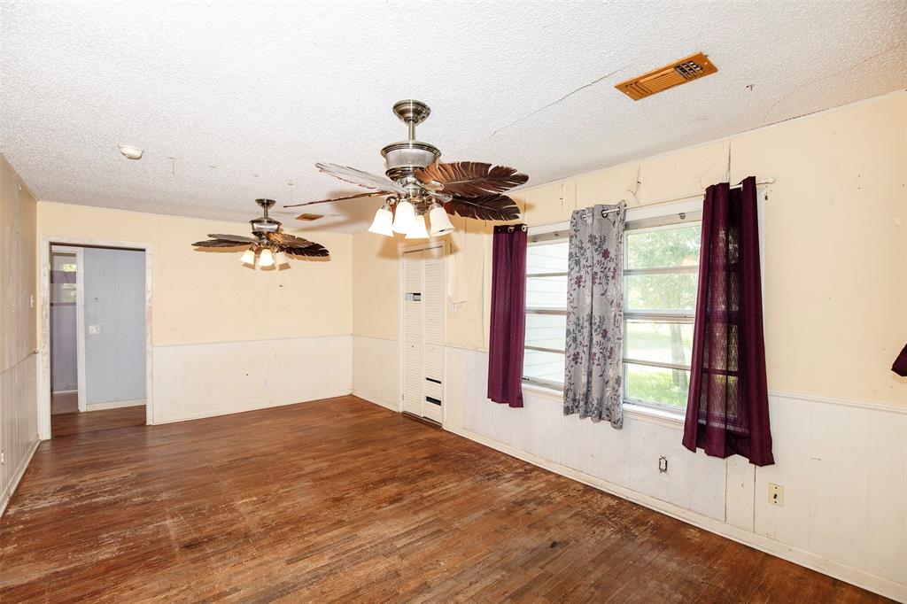 This space could be used as a formal dining room or home office.