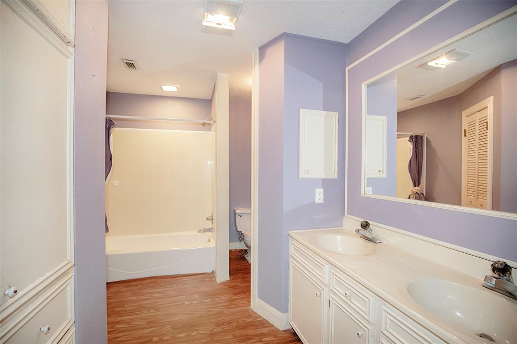 The primary bathroom features double sinks.