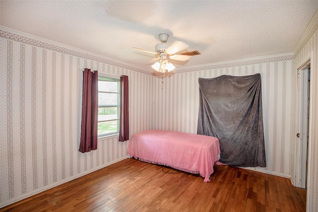 Another spacious bedroom with marvelous wood flooring.