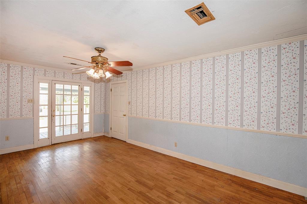 The front door with windows on each side allows the natural light to fill the room.