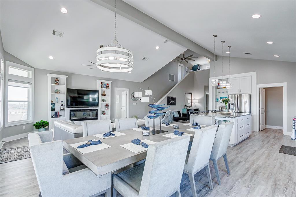 Vaulted ceiling and large open floor plan make this Kitchen, Dining and Living Room a fantastic place to entertain your guests.