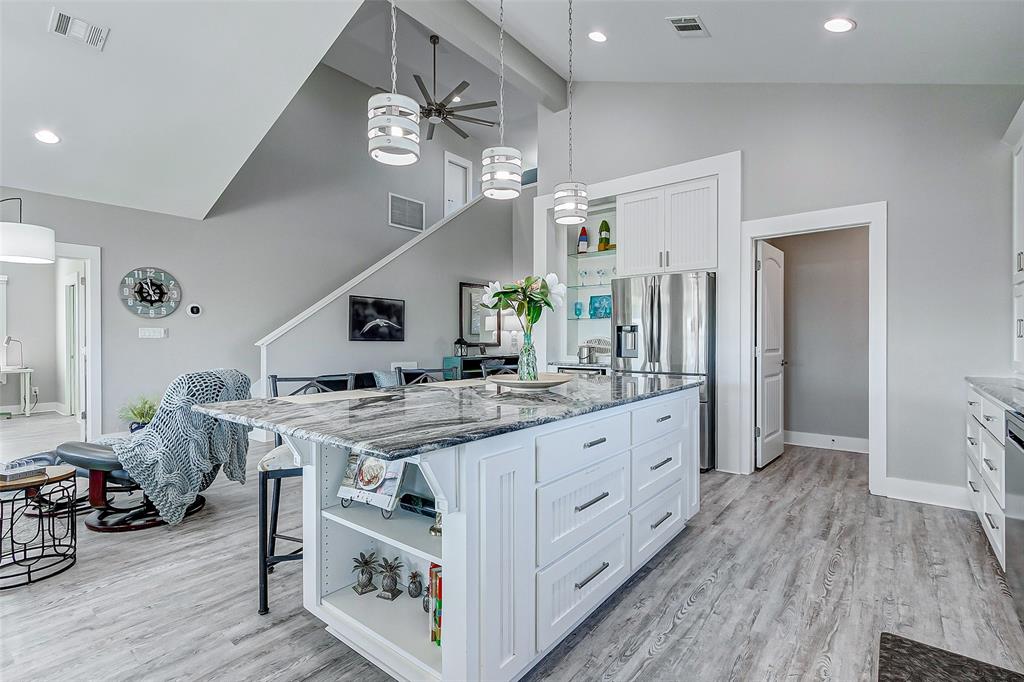 People love to gather in the Kitchen!  This large island provides plenty of storage and space for 4 people to eat.