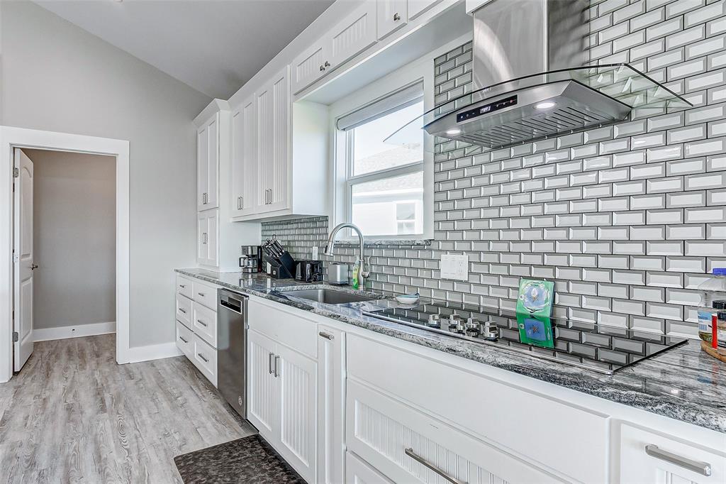 View of the Kitchen with large pantry just steps away.