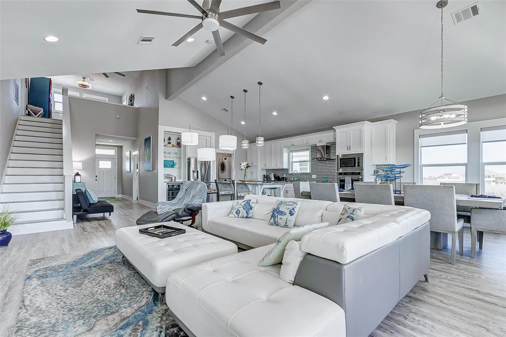 Another view of the open floor plan and steps up to the loft area.