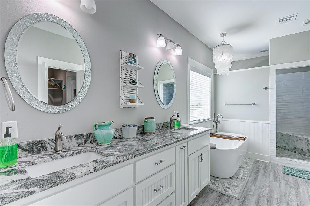 Plenty of counter and cabinet space in this Primary Suite Bathroom.