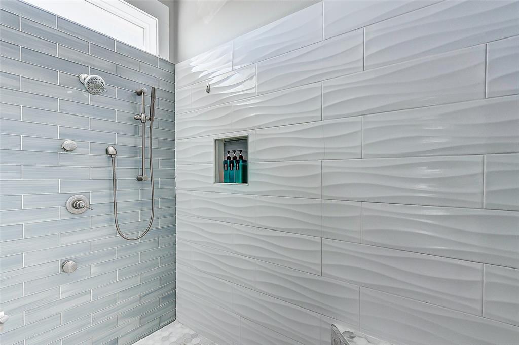 Tile shower in the large Primary Suite Bathroom.