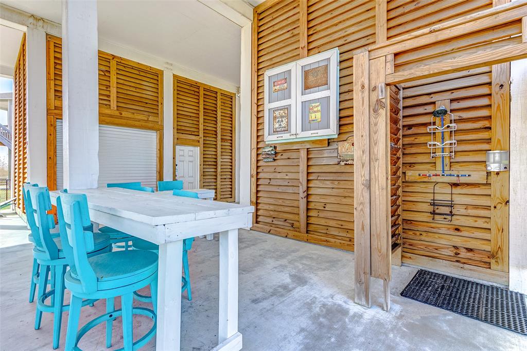 Outdoor bar provides a great space under the house to escape the sun.