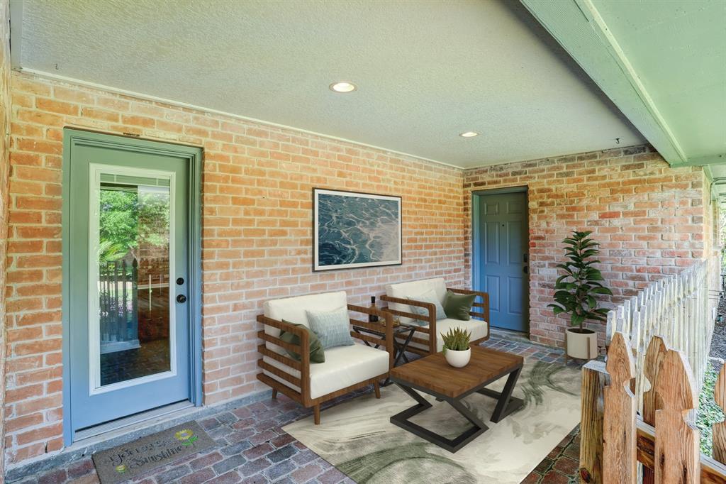 Virtually staged breezeway extends from detached garage to both the gameroom and utility room to 1/2 bath and kitchen