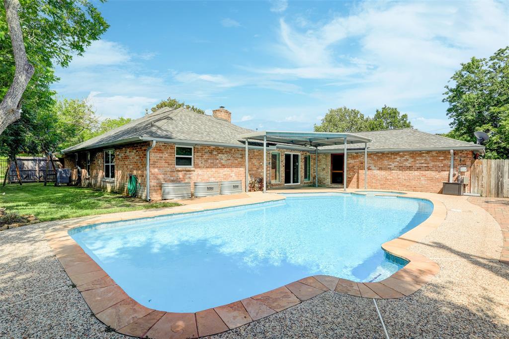 View from back corner shows all aspects of backyard entertainment area