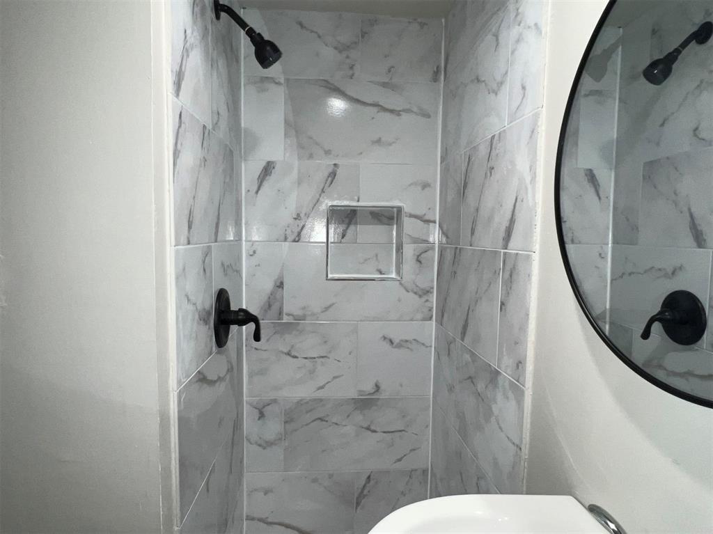 Primary bathroom with beautifully tiled shower