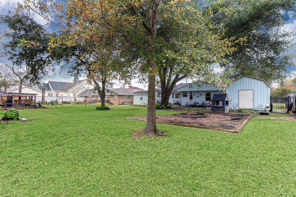 REAR ELEVATION AND SHADED YARD.