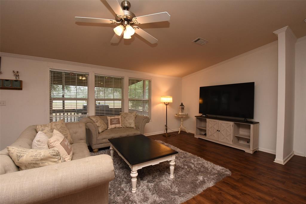 Alternate view of living area with plenty of windows for natural light.