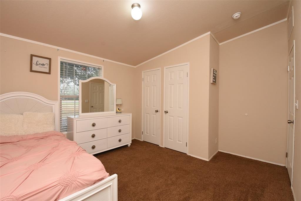 Another view of room #3 showing the large window and closet.