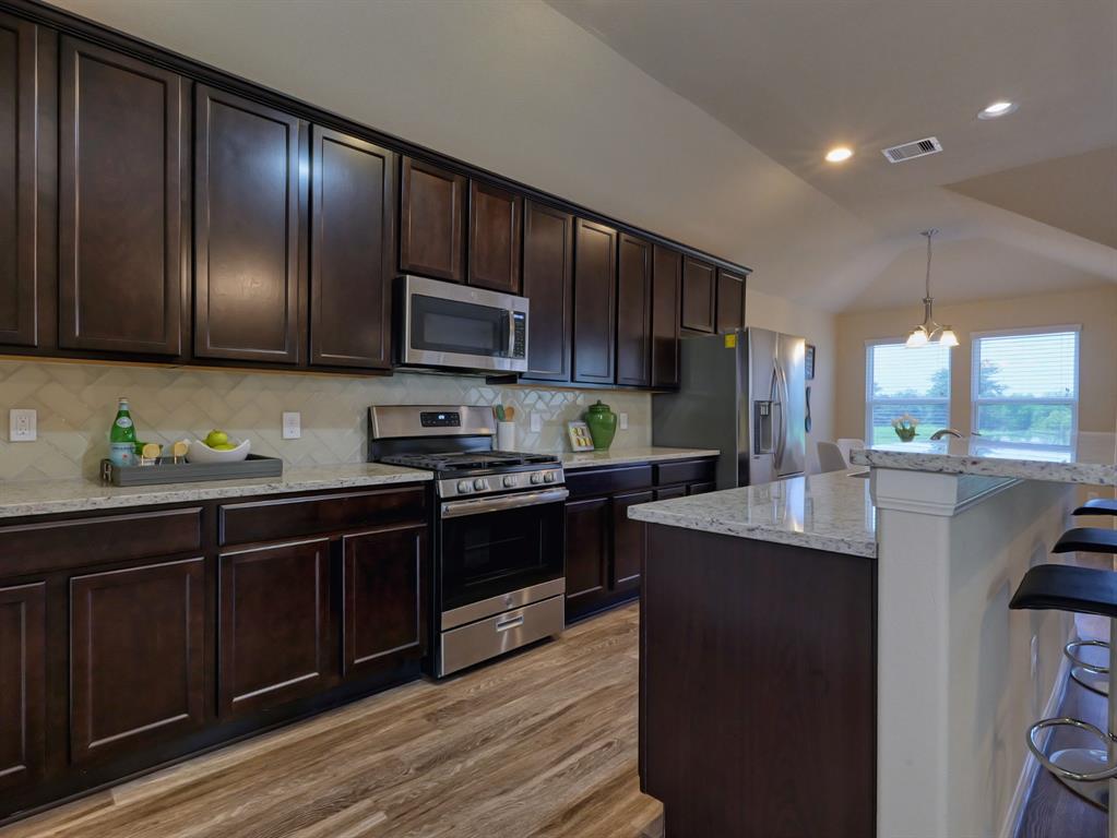 Kitchen and breakfast area open to living area