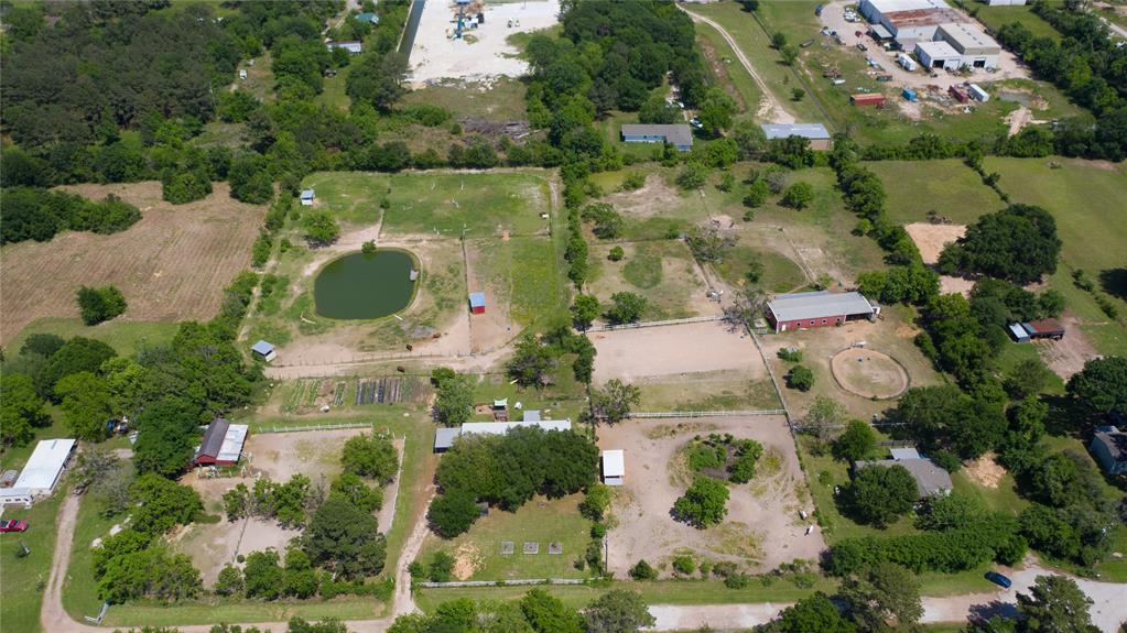 Unrestricted 4.218 Acres (Per Survey) of the HCAD Account # 0462230010016 – Lot 16 located on a quiet cul-de-sac in Cypress, less than a mile from the Grand Parkway. Property is currently an income-producing property with a rental home, horse boarding and riding lessons. The home is 2,250 sq. ft., 4-beds, 2 and ½ baths, covered back porch. Barn includes a tack room, 4 stalls, 2 that open into large paddock turnouts as well as tractor and hay storage areas. Three loafing sheds. The property is completely fenced and currently cross-fenced with 6 pastures, has a large pond with a large dock and expansive organic garden. Tomball School District! No HOA or MUD district. Home Has Never Flooded.