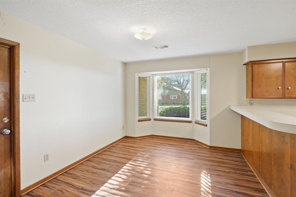 Enjoy the natural light through the picture windows in the breakfast room.