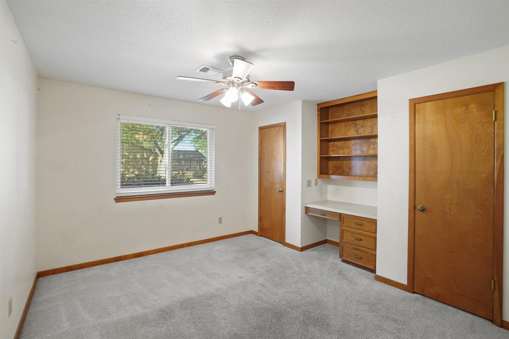 Bedroom two offers built in desk and two closets.