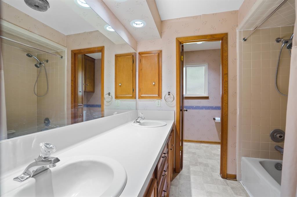 Secondary bath featuring double sinks.