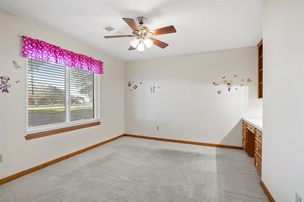 Third bedroom has built in desk and walk in closet.