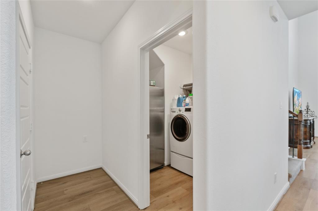 The sizable laundry room can fit two large full size washer & dryer plus a fridge and still roomy to move freely. Plus hanging rods and shelving. on 1st floor conveniently around the corner from the master.