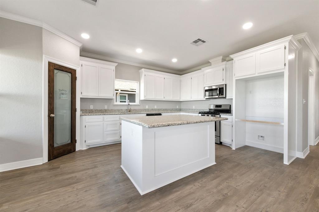 One last look at this gorgeous kitchen located on the main living level of this river front home.