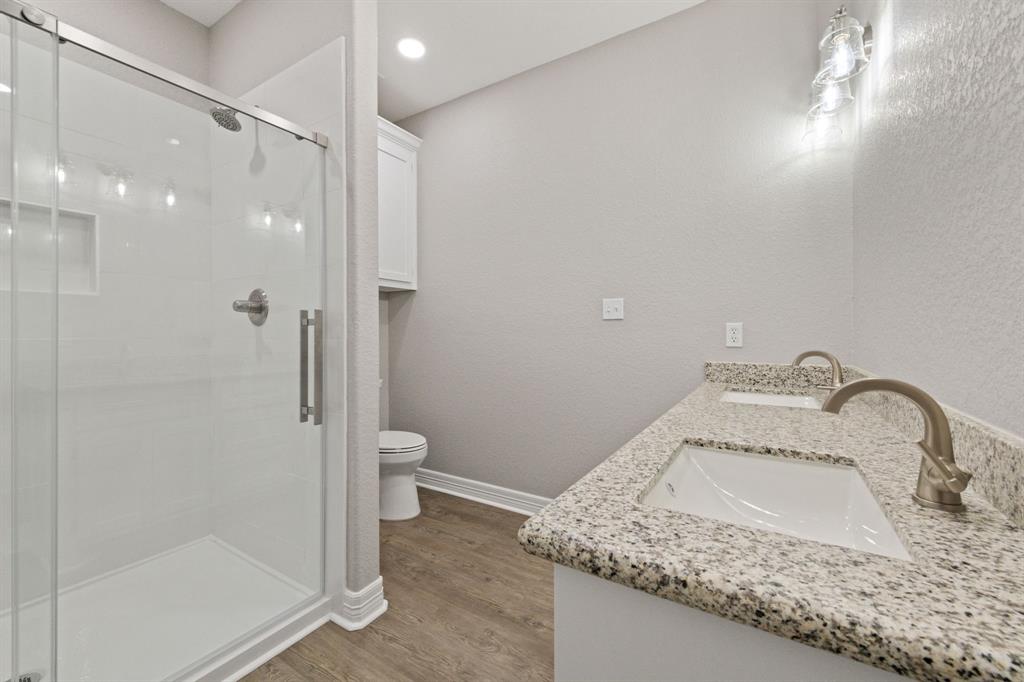 Gorgeous Primary Bathroom with double sinks for convenience and a nice sized, luxurious walk-in shower, offering style and functionality throughout.