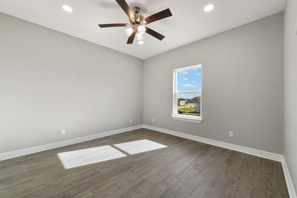 Bedroom 2 with an abundance of natural light, recessed lighting, crown molding & a walk-in closet.